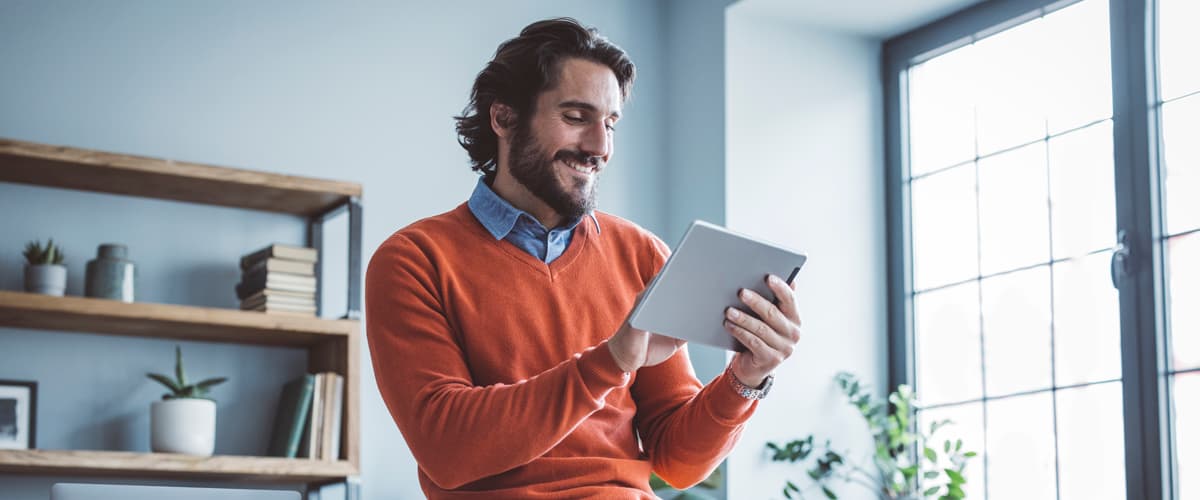 male holding a tablet
